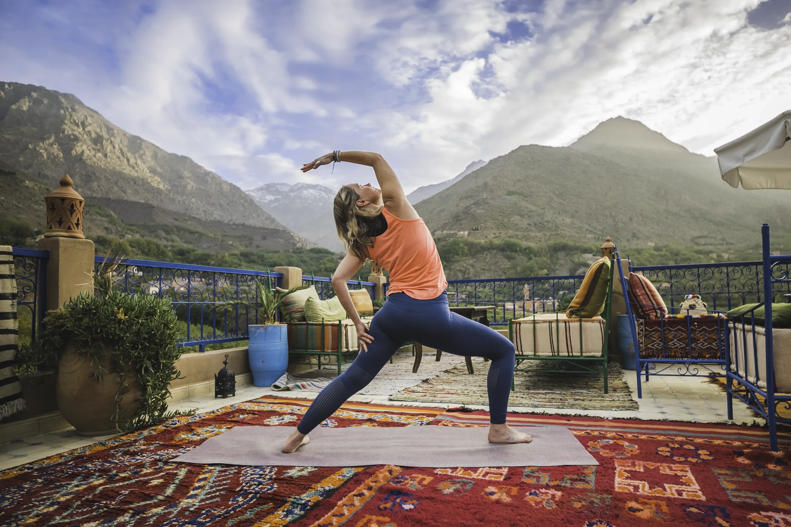 Yoga coach guiding a class in the High Atlas